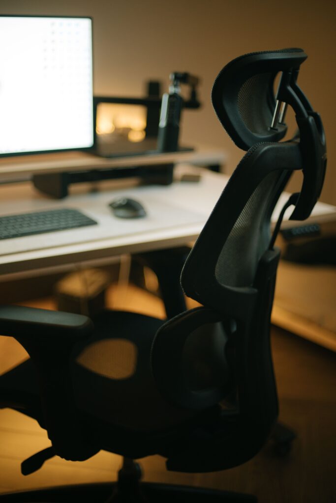 Adjustable lumbar support on a mesh ergonomic office chair
